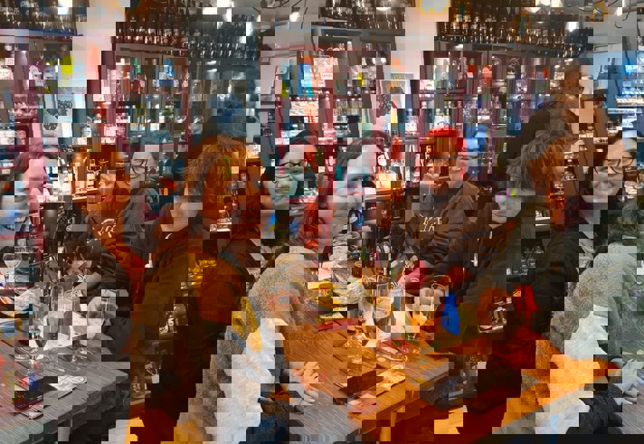 Four people enjoying a night out at Craft & Berry.