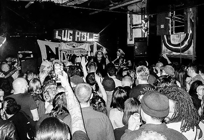 A black and white photo of a concert at The Lughole.