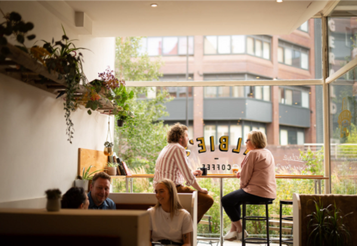 People sat inside Albie's Coffee.