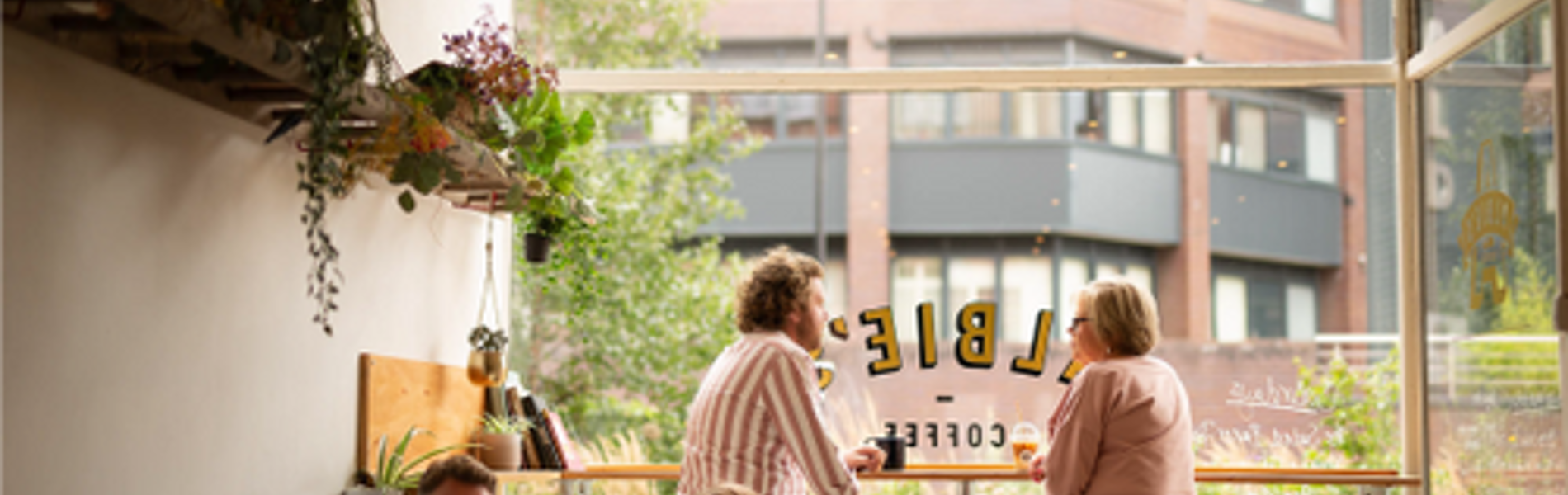 People sat inside Albie's Coffee.