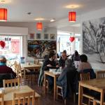 The clean, modern interior of Amici & Bici, with lots of cycling memorabilia.