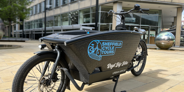 The Sheffield Cycle Tours special bike that has a pod, positioned in front of the rider, where a passenger can sit.