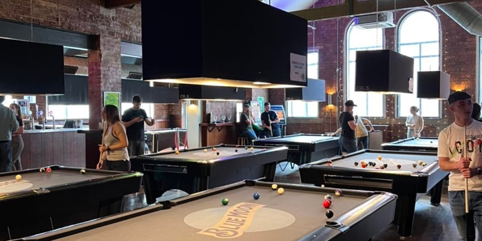 People playing pool at The Common Room.