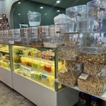 A glass display of the juice and nuts selection