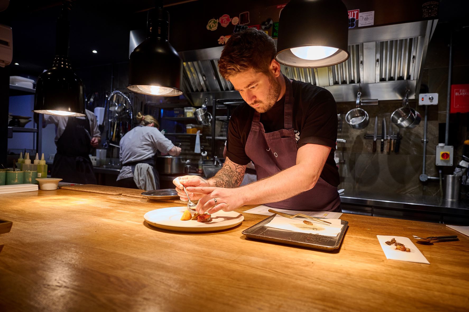 Chef Luke French prepares a dish at  JORO.