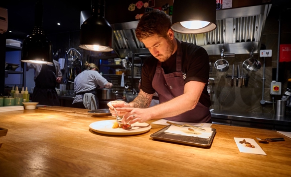 Chef Luke French prepares a dish at  JORO.