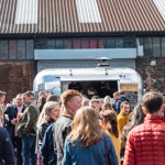 A crowd of people outside at Peddler.