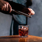 A cocktails being prepared.