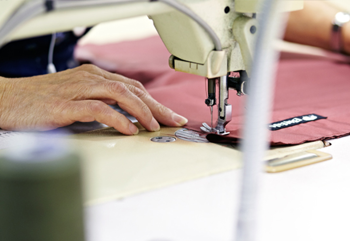 A Buffalo Systems jacket being sewn together.