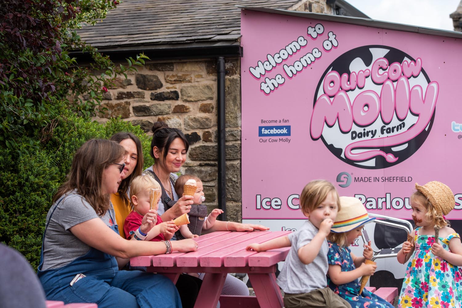 A family enjoying an ice cream at Our Cow Molly Farm.