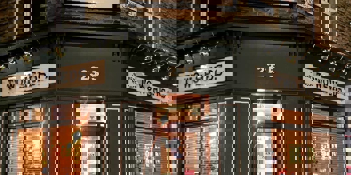 The exterior of the Two Sheds at night.