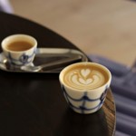 flat white in trendy .coffee cup with ceramic glazed pattern 