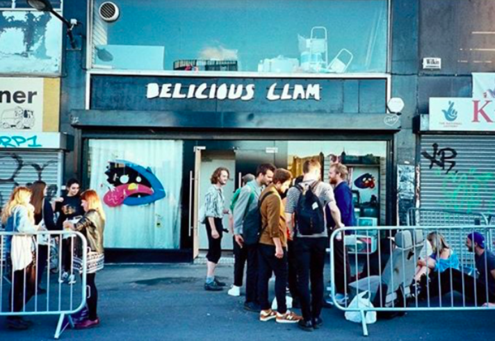 People waiting outside Delicious Clam before a gig.