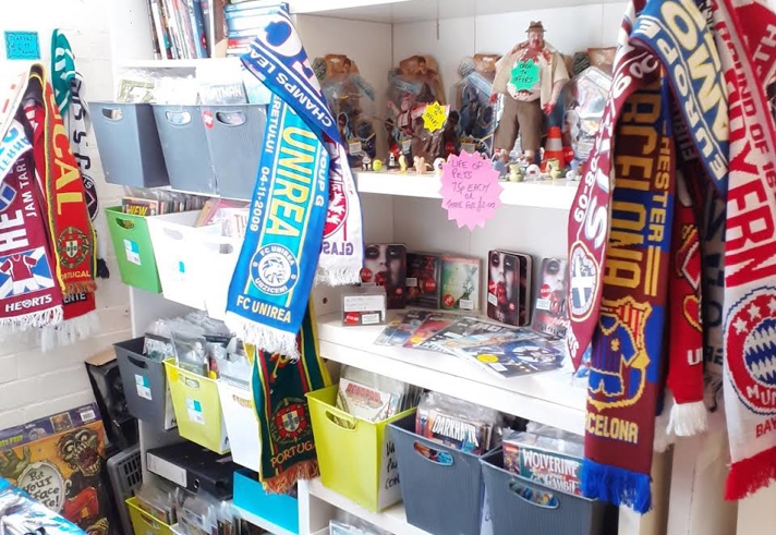 Shelves packed full of things for sale at The Indie Arcade.