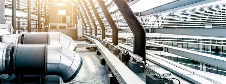 Ventilation pipes and machinery on the roof of a building.