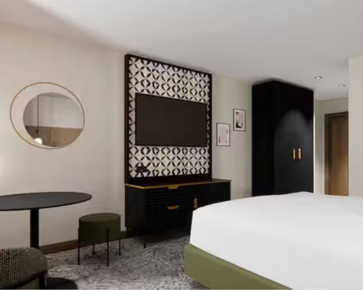 Modern bedroom with TV on wall at the Doubletree by Hilton Sheffield City
