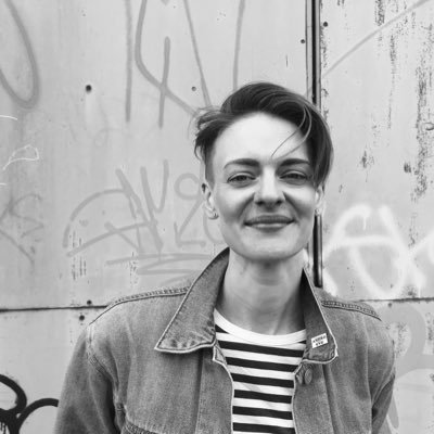 A black and white photo of Finn, who is smiling.