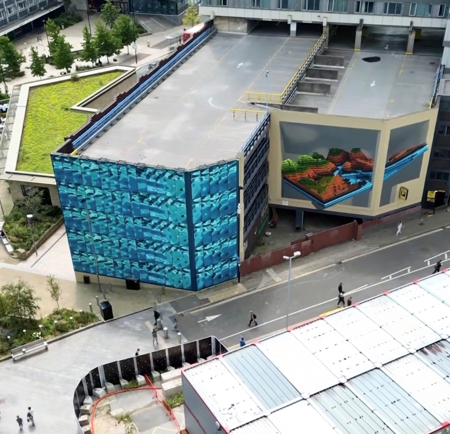 Aerial shot looking down on the building of the NCP car park on Wellington Street in Sheffield where the complete Rivers and Hills mural now adorns it's walls