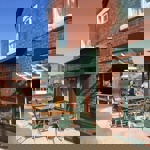 Tables set up outside Kopi & Chai.